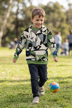 Little boy playing outdoors in your abstract-print hoodie